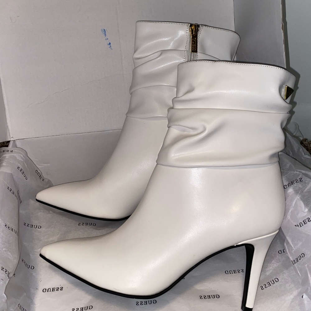 Guess white boot with heel, size 8.5. Never used before